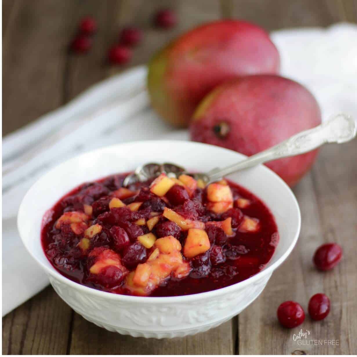 Cranberry Sauce with Mango is a healthier, lower in sugar, recipe that the usual cranberry sauce. CathysGlutenFree.com