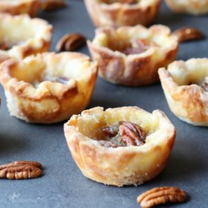 butter tarts set out on grey surface