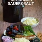 raw sauerkraut on black plate with sausage, lettuce, and red onion, title text.