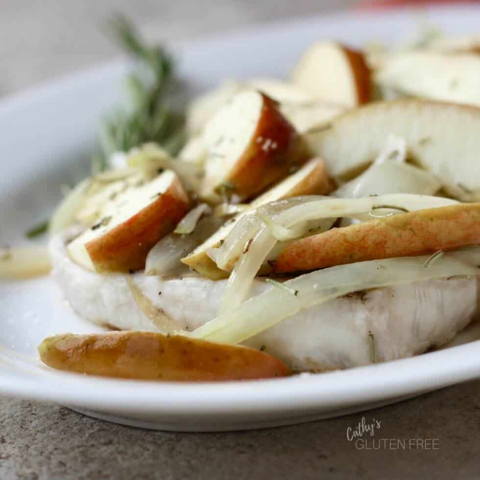 grilled pork chops topped with cooked apples and onions