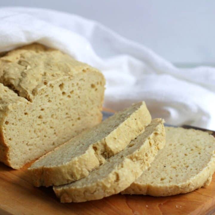 sliced bread on wooden board.