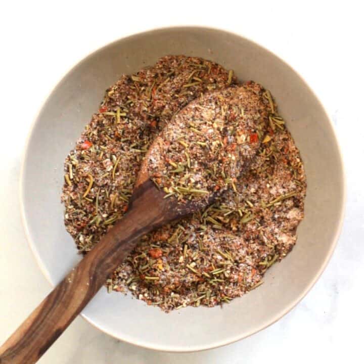 looking down of a bowl of spice mix with a wooden spoon