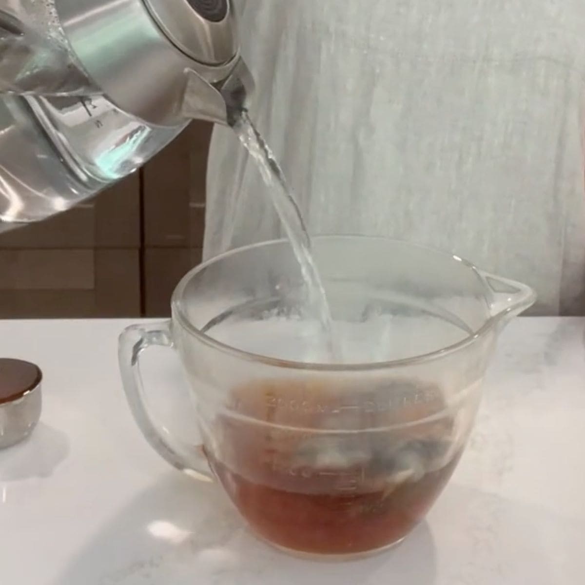 boiling water pouring over tea bags.
