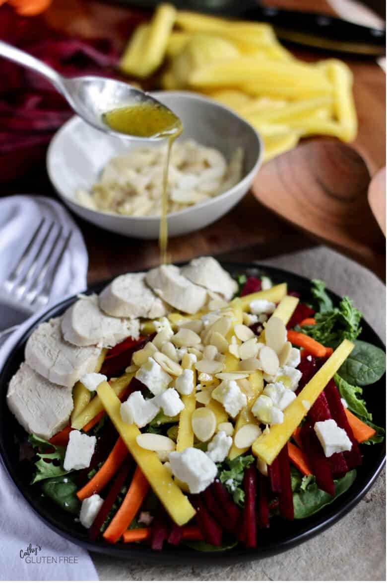 Honey Dijon Dressing drizzled over Mango Avocado Salad with Chicken
