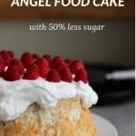 round sponge cake topped with whipped cream and berries