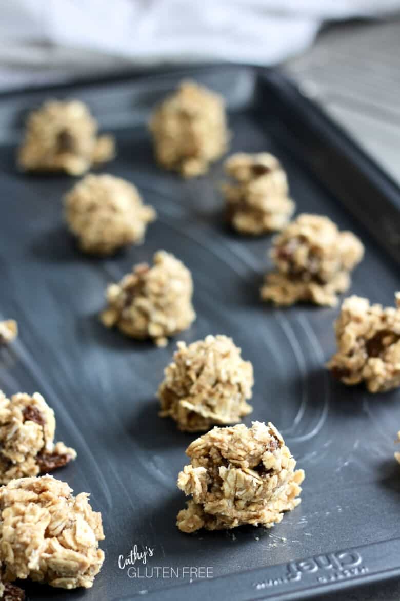 balls of raw cookie dough on prepared pan