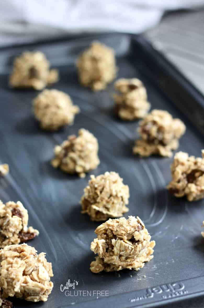 balls of raw cookie dough on prepared pan