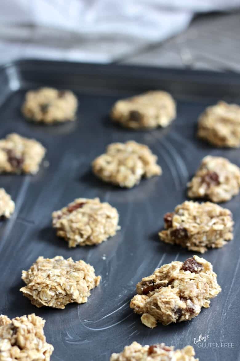 flatten balls of raw cookie dough on prepared pan