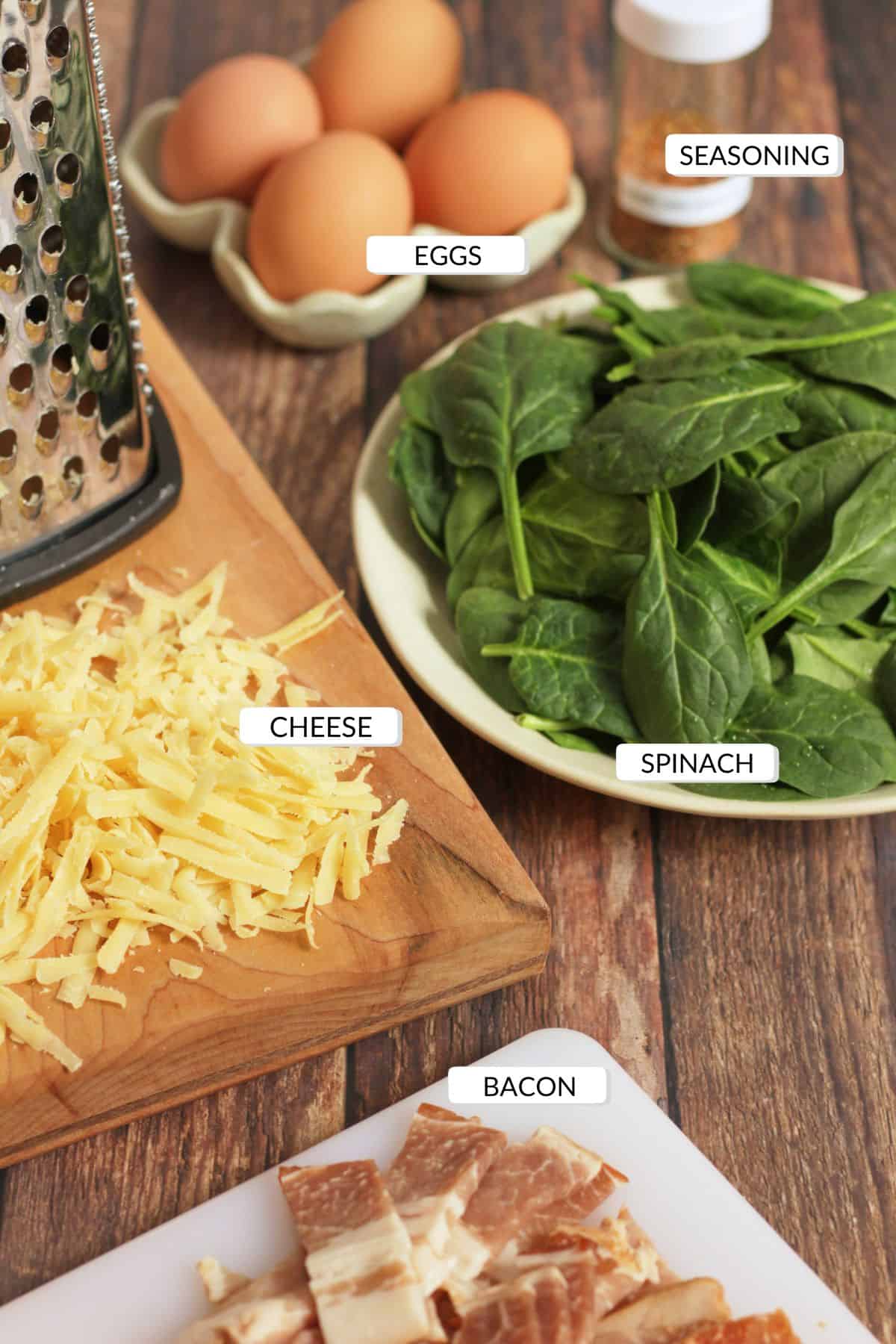 eggs, spinach, shredded cheese, and chopped bacon with labels