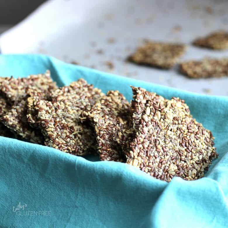 Flax Seed Crackers in a turquoise napkin-lined dish