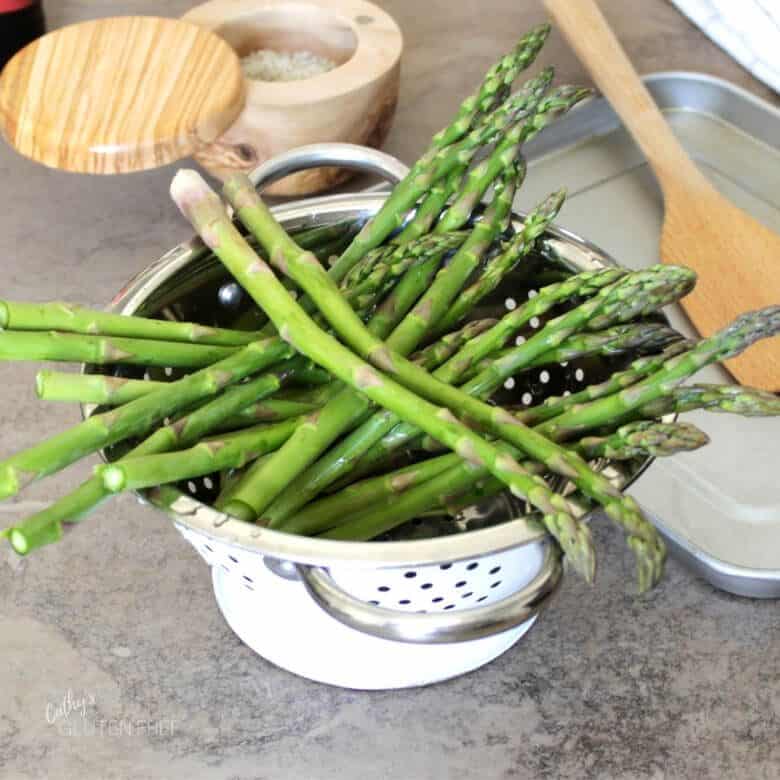 asparagus spears in colander