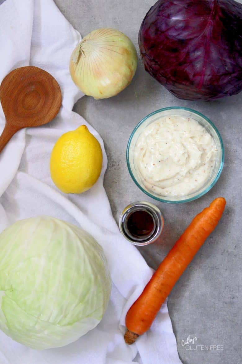 red and green cabbage, lemon, carrot, onion, mayonnaise, maple syrup