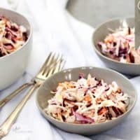 creamy coleslaw in three bowls