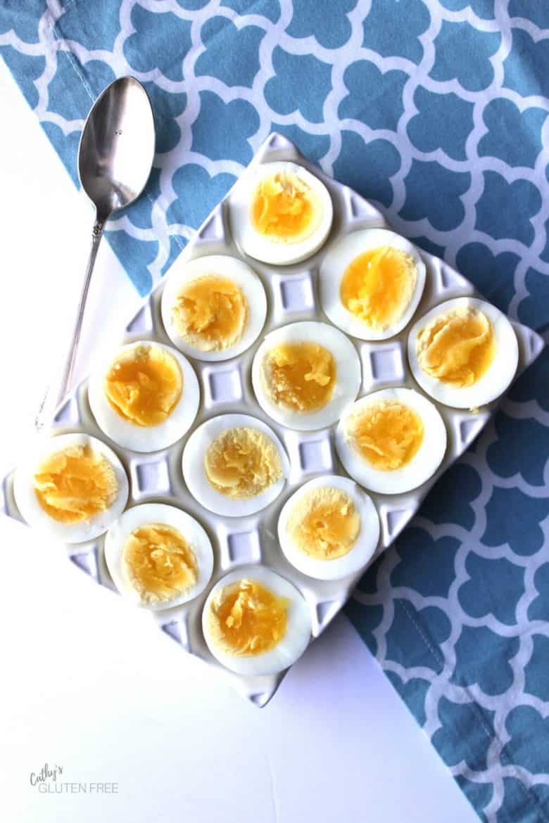 Boiled eggs cut in half, revealing moist centres