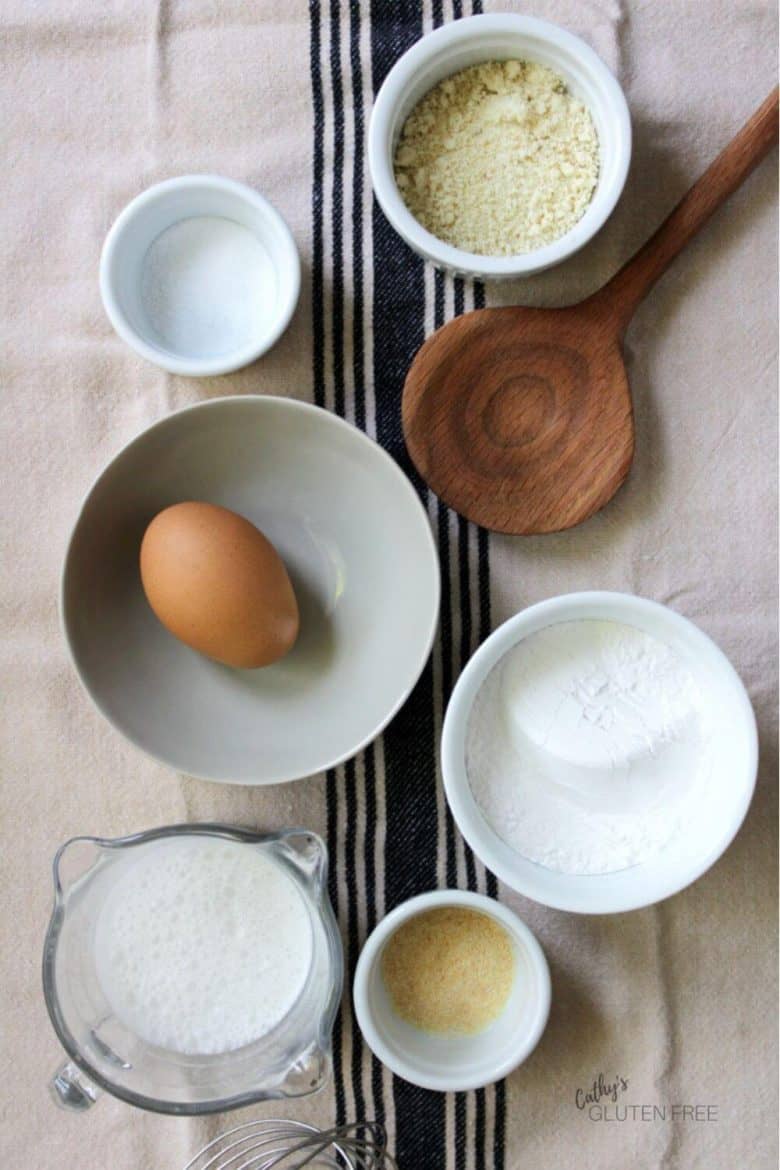 six bowls with egg, salt, garlic powder, almond flour, tapioca starch, and nondairy milk