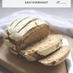 sliced round loaf of dark gluten free bread