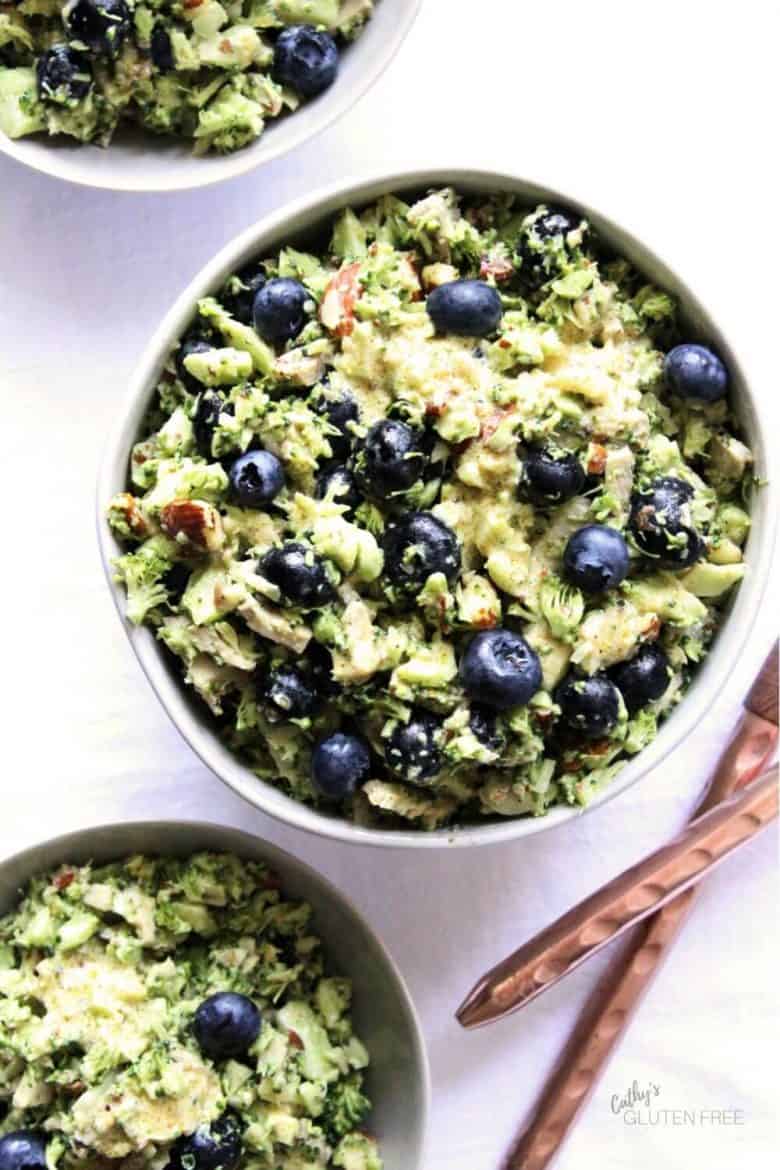 overhead view of blueberry slaw in three bowls