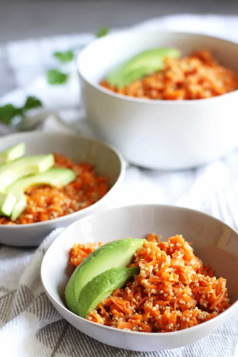 carrot slaw garnished with avocado slices