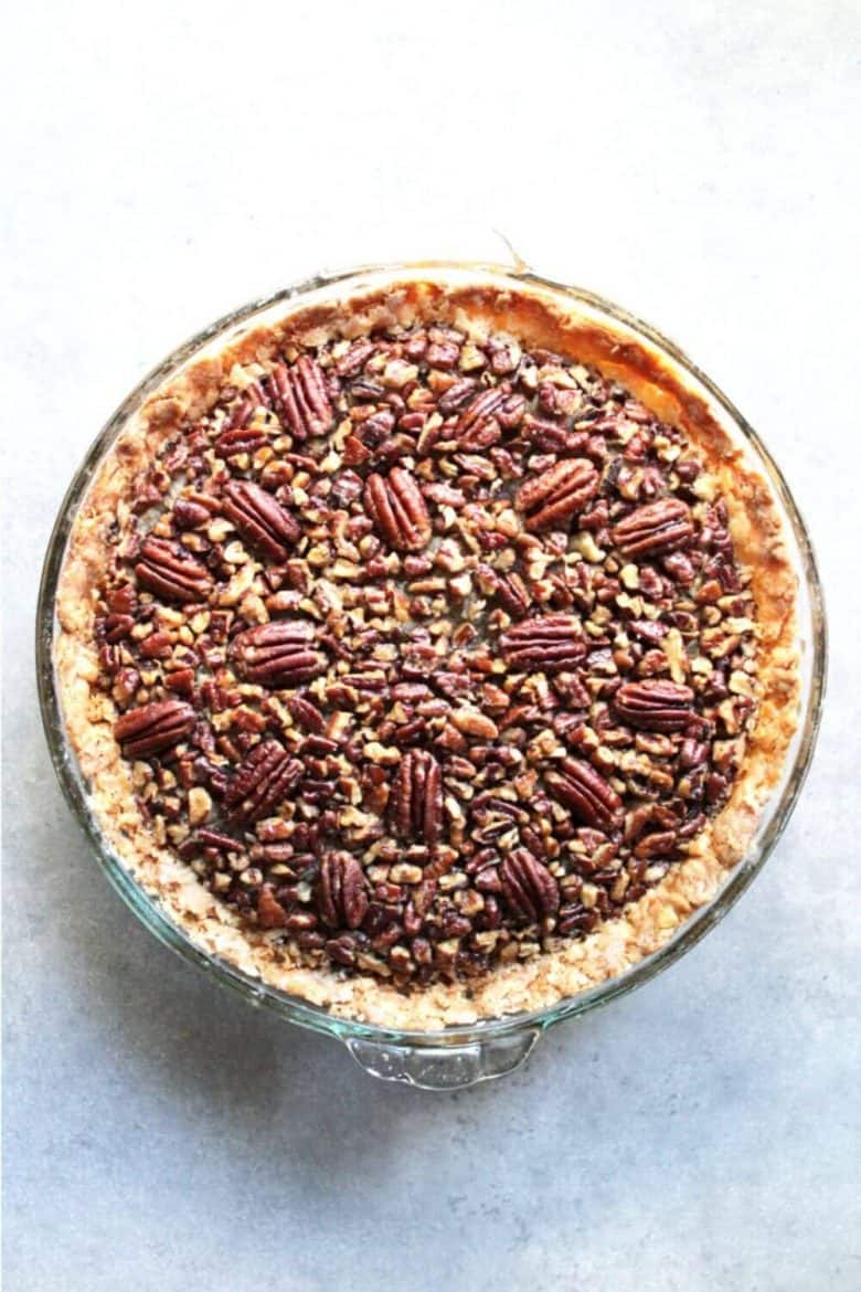 top down view of pecan pie in glass plate