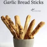 bread sticks standing vertically in mug