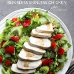sliced chicken on lettuce salad