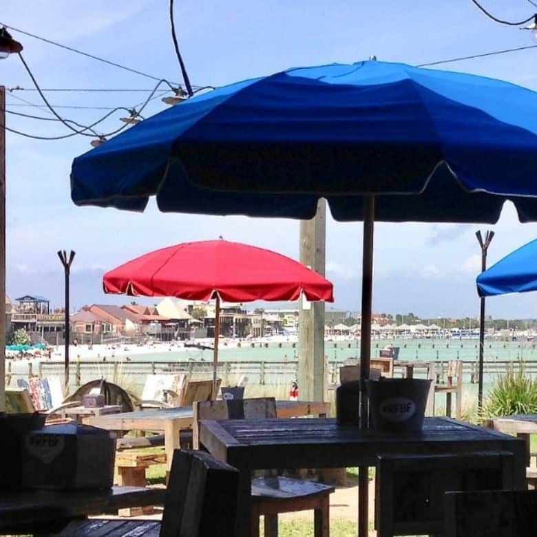 red and blue patio umbrellas on beach