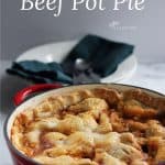 pie crust topped beef pot pie in red pot