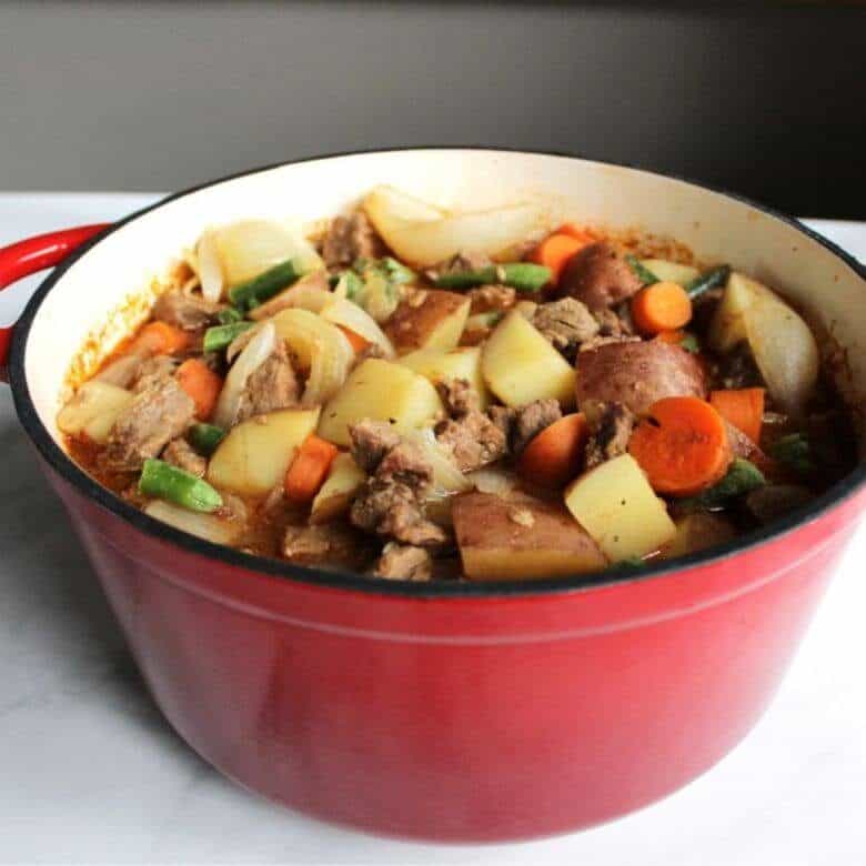 stewed beef, carrots, and potatoes in red pot