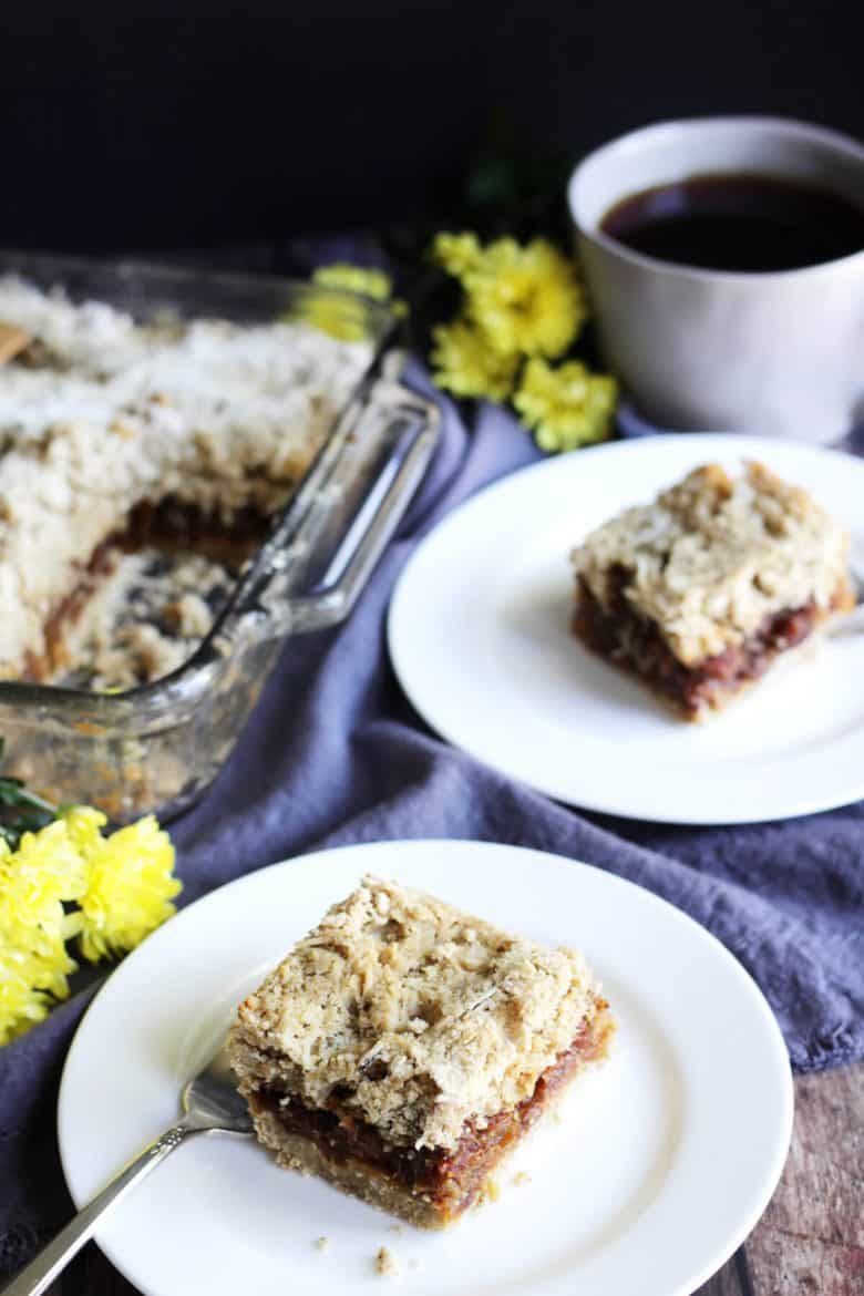 gluten free date squares, two served on white plates