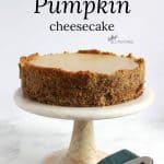 cheesecake with almond crust on marble pedistal