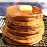 stack of golden pumpkin pancakes with butter melting on top.