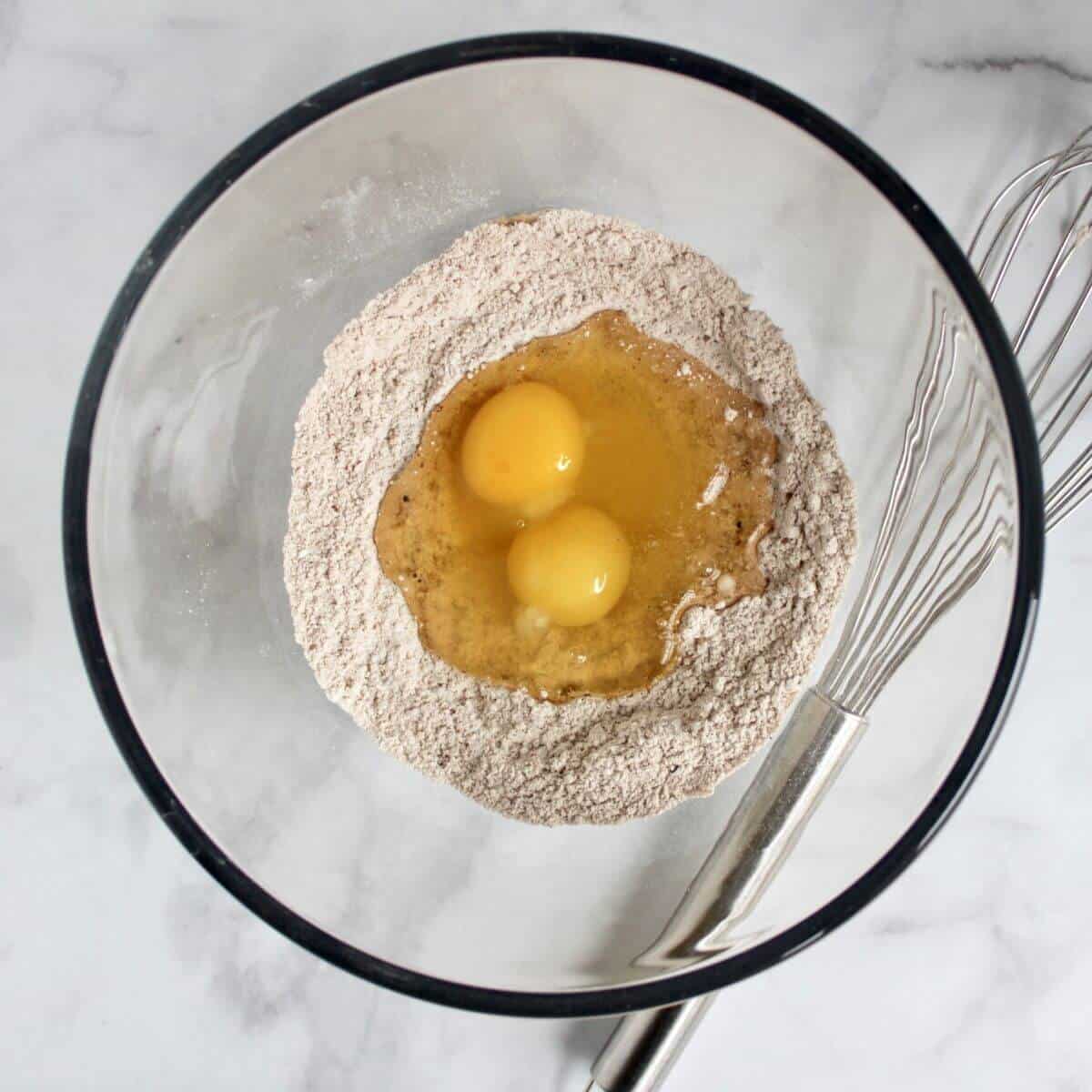 two eggs in well in centre of flour mixture