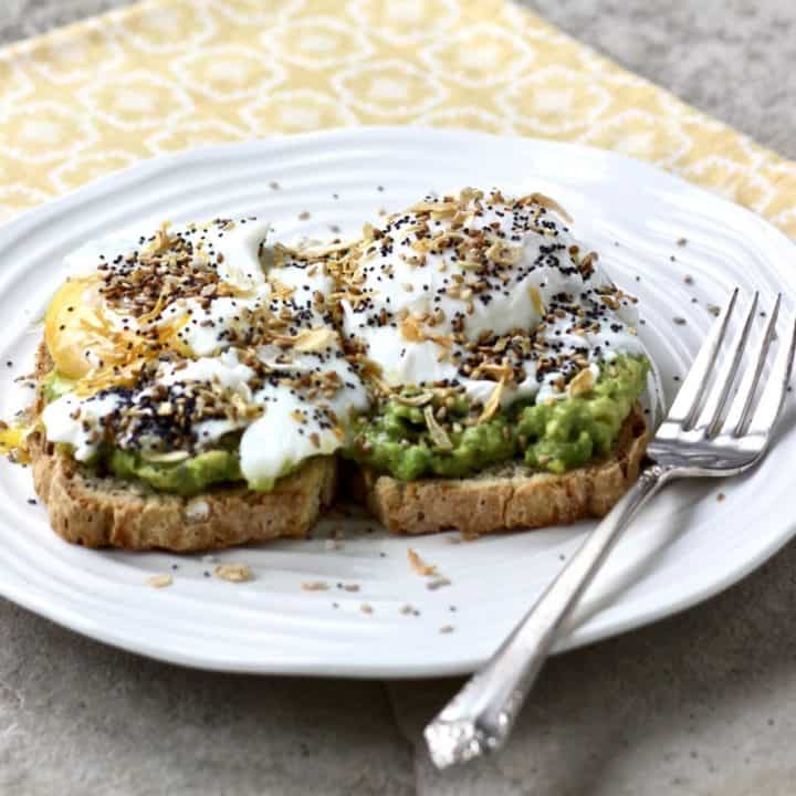 fried egg, avocado layered on toast