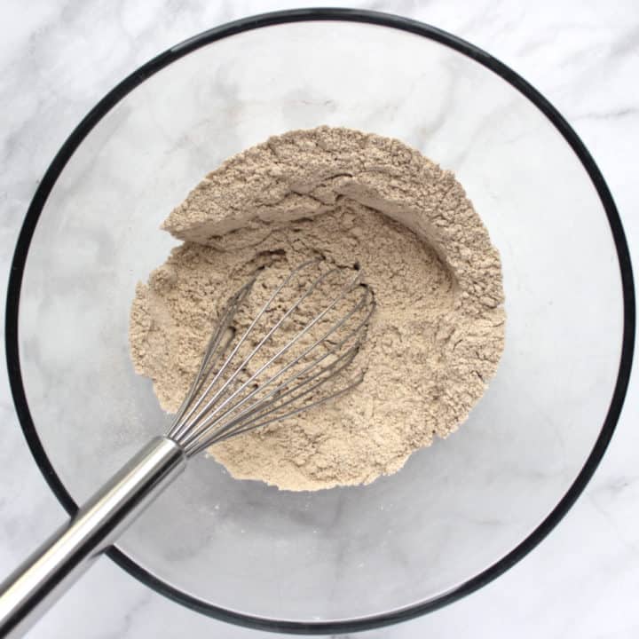 brownish flour mixture in bowl with whisk