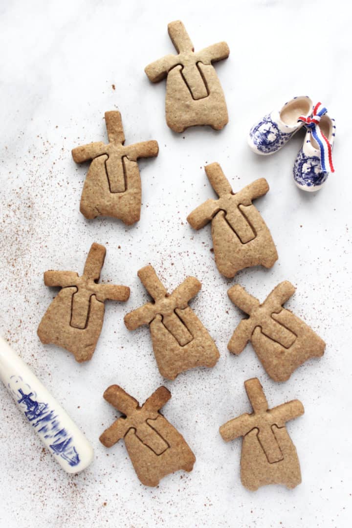 windmill-shaped cookies scattered over marble surface