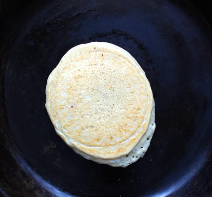 fluffy gluten free pancake in pan, cooked side up