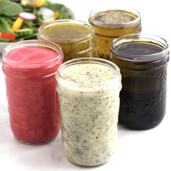 5 jars of salad dressing, pink, white, brown, golden