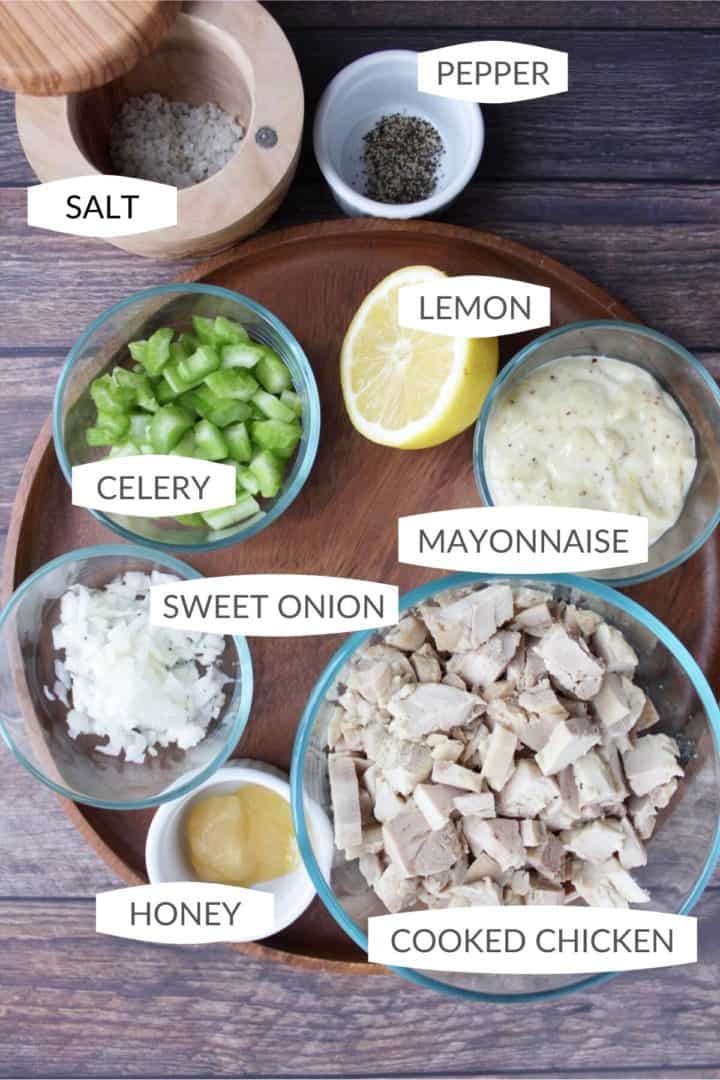 chicken salad ingredients laid out is small bowls with labels