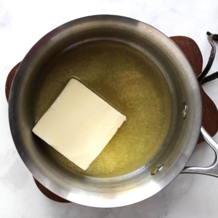 butter melting in small stainless saucepan