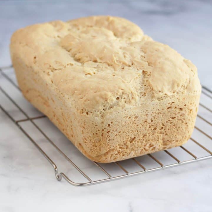 freshly baked loaf of bread on cooling rack