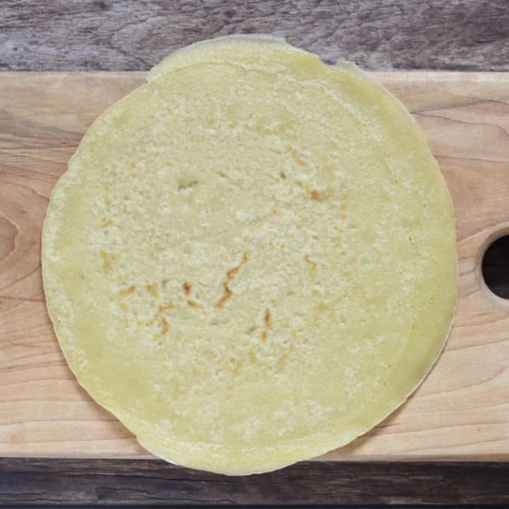 gluten free tortilla lying flat on wooden board