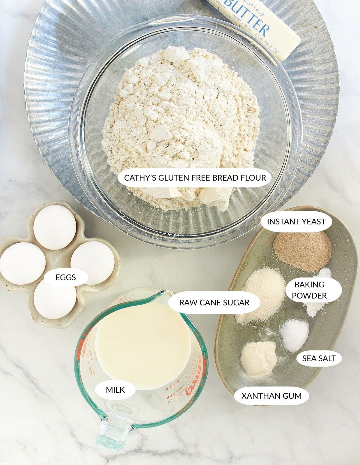 gluten-free brioche bread ingredients in small bowls, labeled.