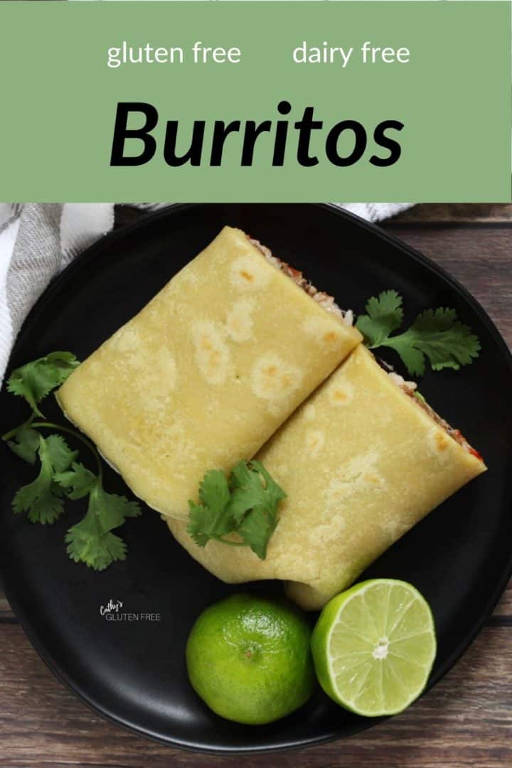 two burritos with lime and cilantro on black plate, viewed from above, with text 