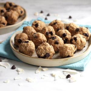 several peanut butter balls with chocolate chips on a plate