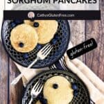 overhead view of pancakes on two black plates.