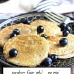four pancakes on a black plate, with Pinterest title.