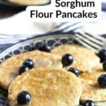 pancakes on black plate with blueberries.