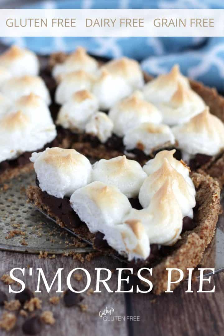 a slice is being removed from the s'mores pie