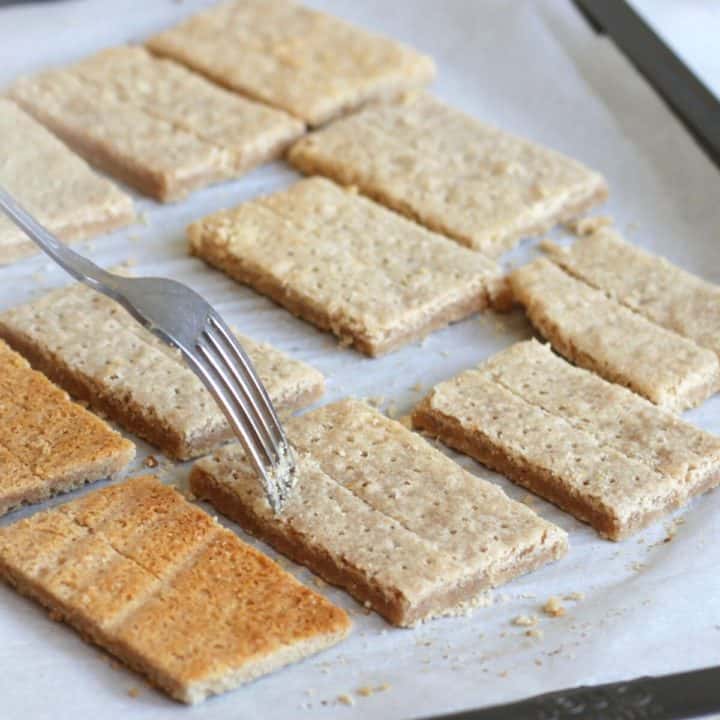 a fork pokes holes into crackers