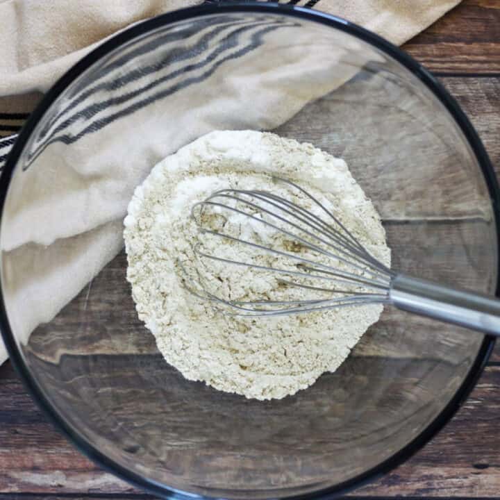 whisk in flour mixture in glass bowl